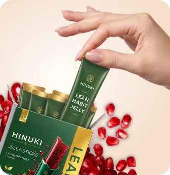 Hinuki Korean Jelly Stick sachet showing deep green packaging with gold botanical emblem and rich red pomegranate jelly with chia seeds